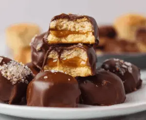 Delicious homemade Twix bites with crunchy biscuit base, caramel layer, and smooth chocolate coating, perfect for a sweet treat