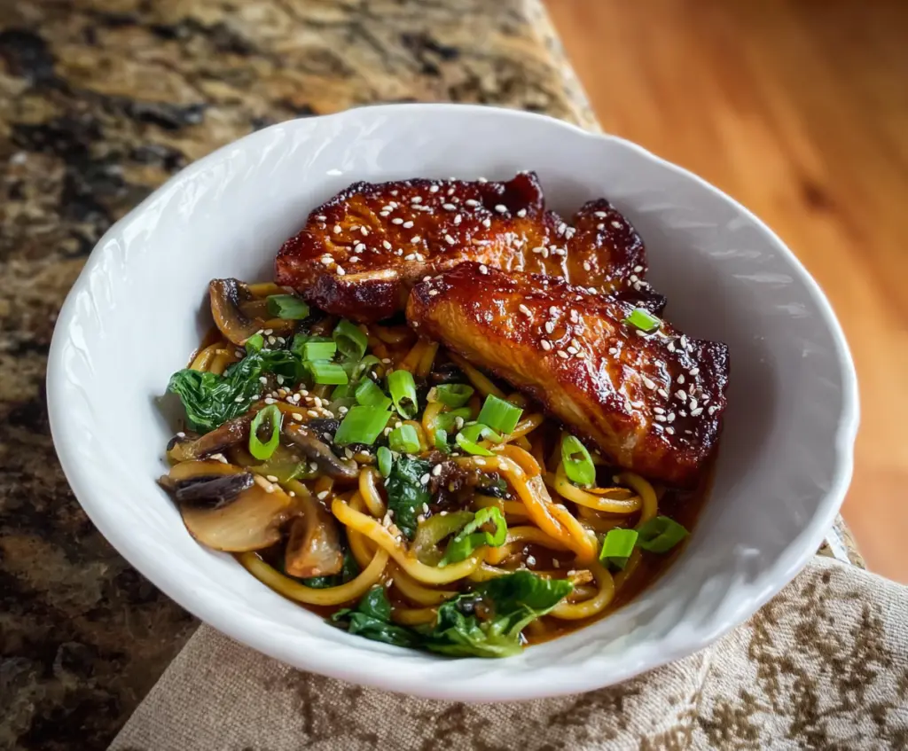 Delicious veggie udon noodles with colorful vegetables and savory sauce.